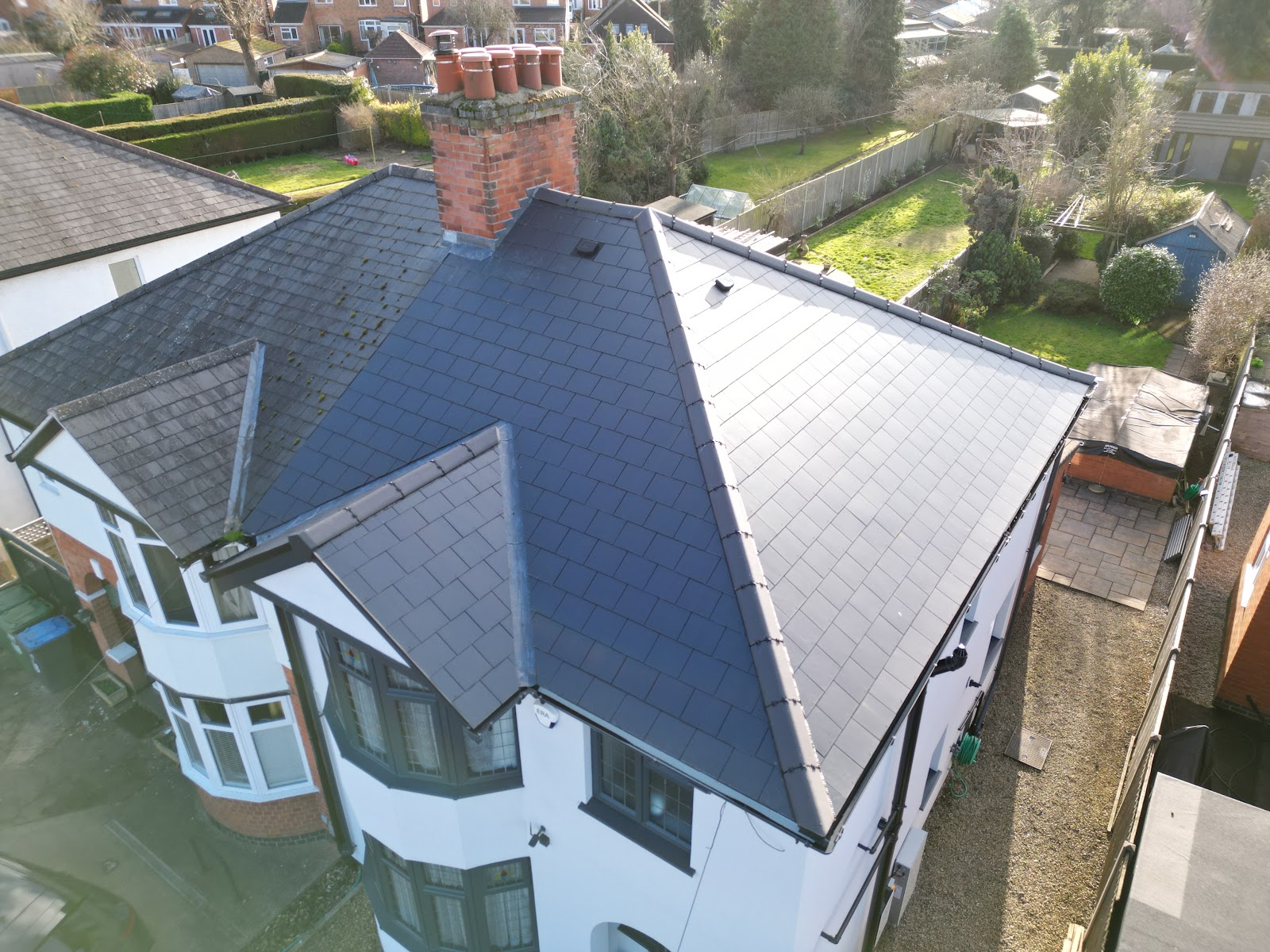 A completed natural slate roof on a Coventry house, fitted by Morgan Roofing